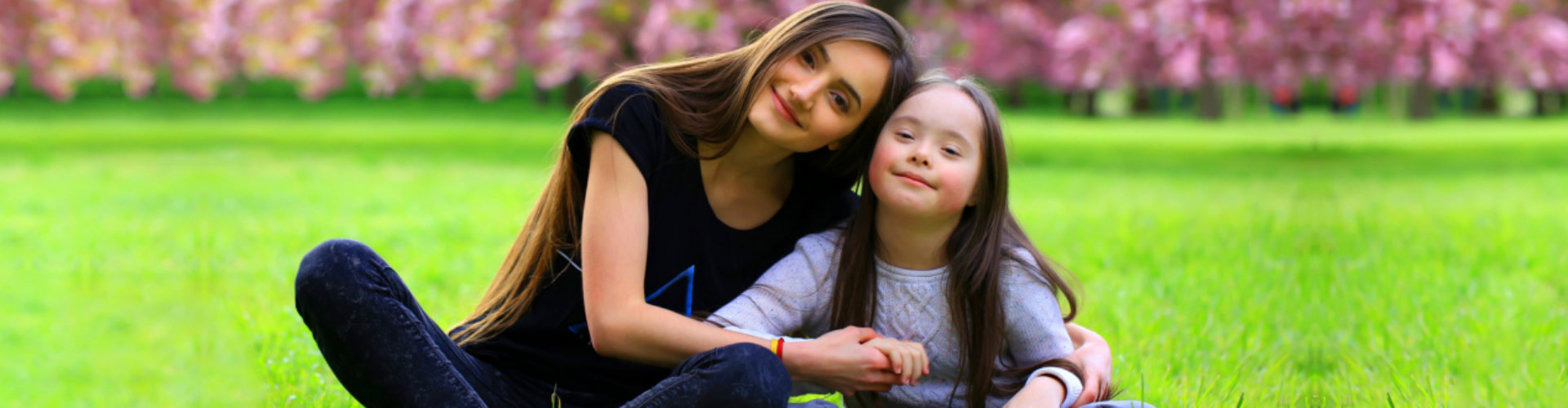 adult woman and little girl smiling