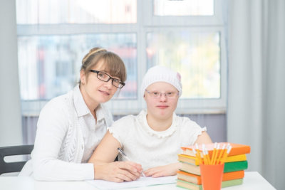 portrait of happy adult woman and the girl wearing eyeglasses smiling