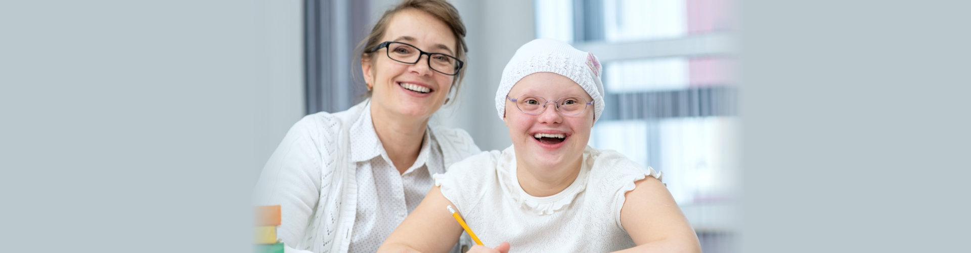 smiling woman and girl wearing eyeglasses