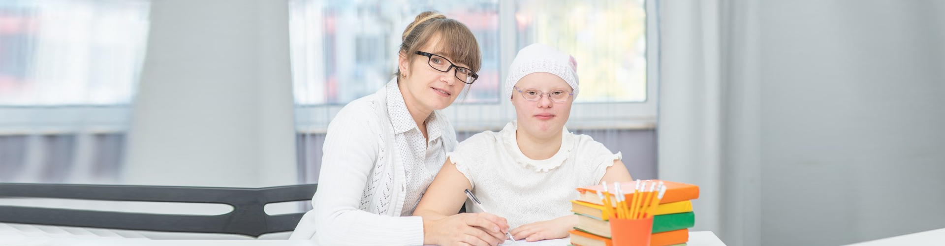 portrait of happy adult woman and the girl wearing eyeglasses smiling